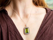 wearing an Edwardian peridot pendant