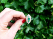 1930's emerald ring with diamonds outside