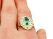 1930's emerald ring with diamonds on finger