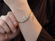 opal and diamond bangle on wrist