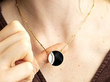 onyx round pendant on neck