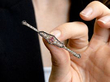 holding a ruby and diamond bar brooch