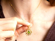 showing a gold peridot pendant