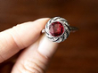 garnet dress ring in hands