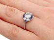 old cut diamond and sapphire ring on finger
