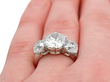 wearing a Diamond trilogy Ring in White Gold 