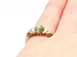 cats eye ring in yellow gold on hand