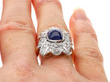 cabochon sapphire ring on finger