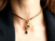 wearing garnet snake necklace