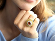wearing garnet cocktail ring in gold