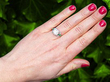 Diamond Solitaire with Emerald Side Stones Wearing 