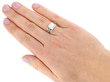 Diamond Solitaire with Emerald Side Stones Wearing 