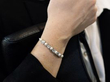diamond and pearl bracelet on wrist