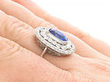 Cushion Cut Sapphire Ring with Diamonds being worn