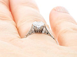 round cut engagement ring on finger
