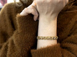 pearl and gold bracelet on wrist