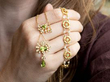 holding peridot pendants