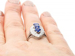 wearing a Blue Sapphire and Diamond Cluster Ring for Sale