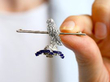 Diamond and Ruby Regimental Brooch in White Gold In Hand