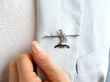 Wearing Diamond and Ruby Regimental Brooch in White Gold