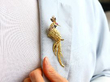 Wearing Yellow Gold and Gemstone Peacock Brooch