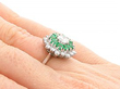 White Gold Emerald Diamond Cluster Ring on finger