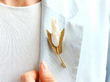 Wearing Feather Brooch