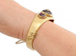 Gold Garnet Bangle being worn