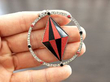 holding coral and onyx pendant