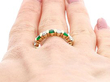 emerald and diamond eternity ring on hand