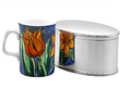 Antique Silver Biscuit Box next to a mug