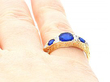 Sapphire and Diamond Ring Being Worn
