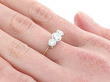 A 3 Diamond Ring in Gold on the Hand 