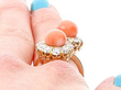 Antique Rose Gold and Coral Being Worn on the Hand
