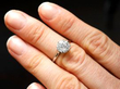 Diamond and Platinum Solitaire Ring On Finger