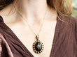 wearing a victorian onyx pendant