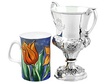 Antique Silver Cup next to a mug