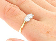 Yellow Gold Trilogy Engagement Ring On Hand 