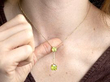 wearing peridot pendant in gold