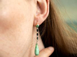 wearing jade and onyx drop earrings