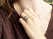 wearing a black onyx and diamond ring