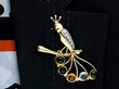 Wearing Gemstone Spray Brooch in Yellow Gold