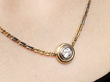 Wearing Bezel Set Diamond Pendant in Gold