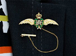 Gold RAF Wings Brooch with Emeralds for Sale Wearing