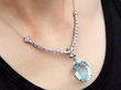 Diamond Necklace with Aquamarine Pendant being worn