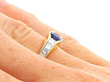 sapphire and diamond ring on finger