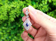 lozenge cut sapphire earrings with diamonds outside