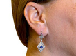 lozenge cut sapphire earrings with diamonds wearing