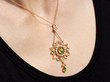 Wearing Pearl Peridot Pendant in Yellow Gold for Sale
