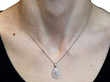 wearing platinum pear cut diamond pendant 